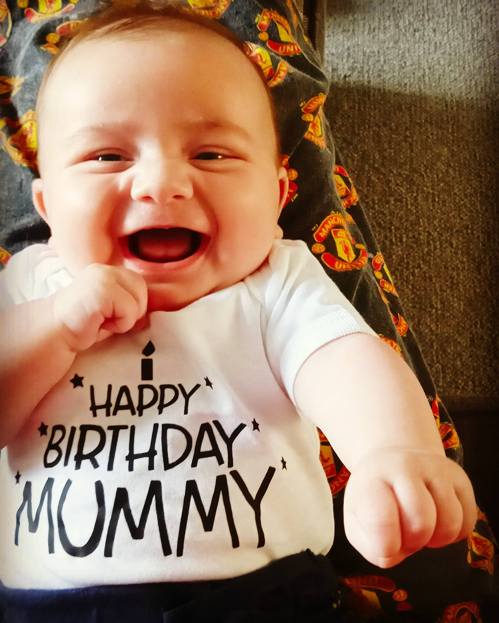 George joined the competition — help win amazing prizes! baby, baby_laughing, baby_toddler_clothing, cheek, child, chin, cool, eye, facial_expression, finger, font, fun, gesture, happy, person, photo_caption, sleeve, smile, t_shirt, thumb