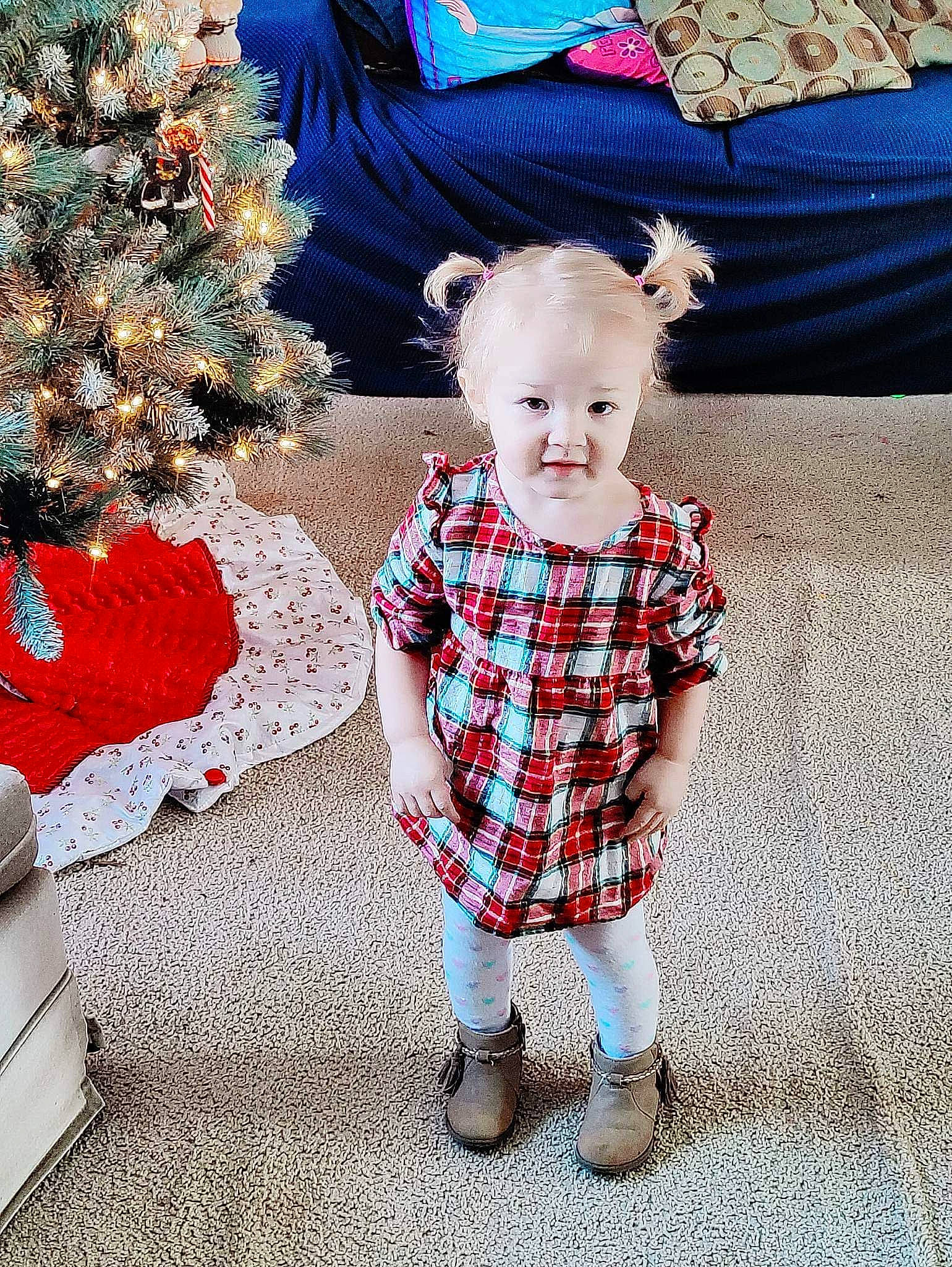 Miya is registered to the contest to win money with this photo: baby, baby_toddler_clothing, blue, christmas_ornament, christmas_tree, electric_blue, event, happy, holiday_ornament, human_body, pattern, person, plaid, red, sleeve, smile, standing, tartan, textile, toddler