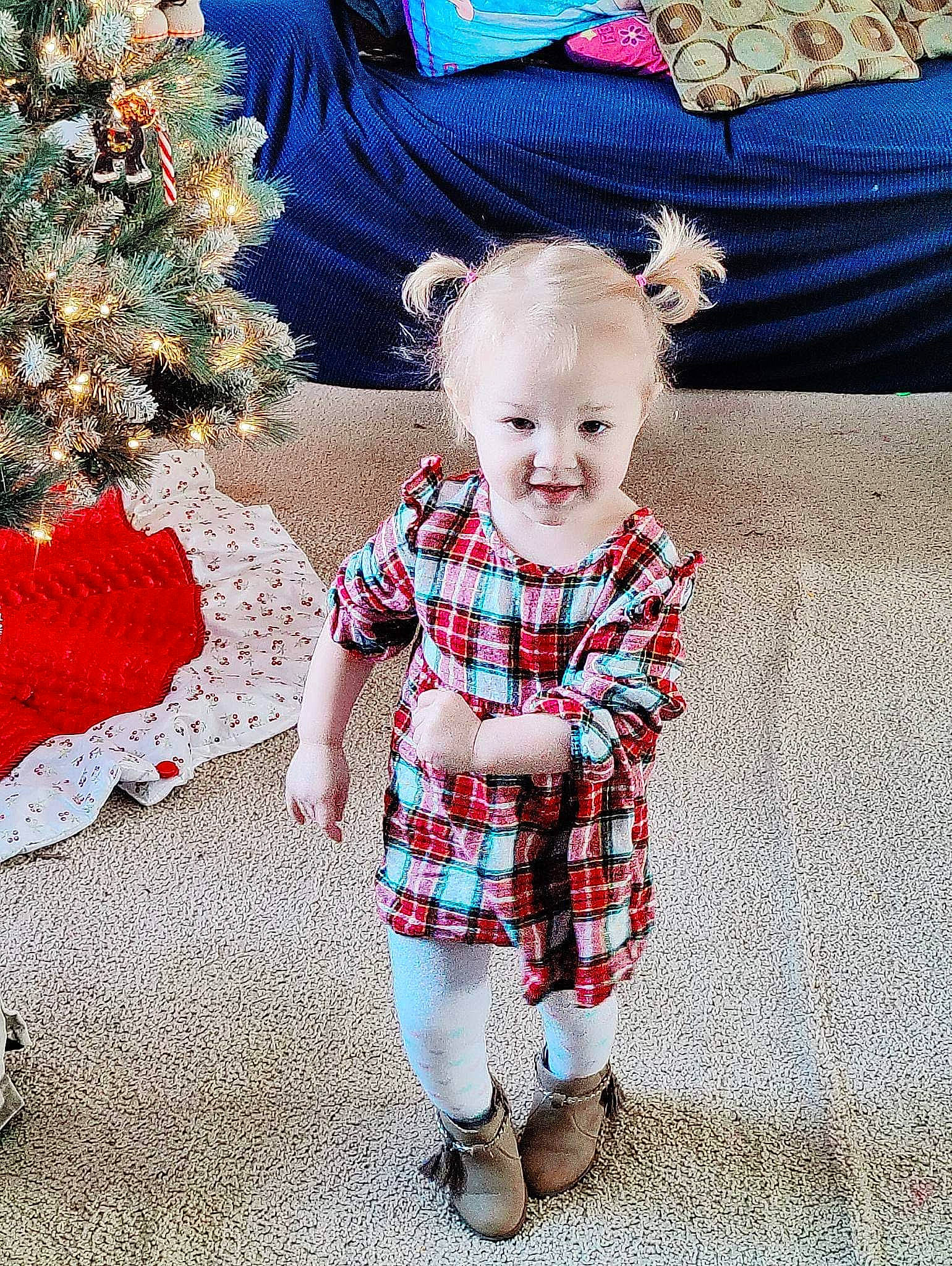 Miya joined the competition — help win amazing prizes! baby, baby_toddler_clothing, child, christmas_ornament, christmas_tree, event, fun, happy, holiday, holiday_ornament, ornament, pattern, person, plaid, sitting, sleeve, smile, standing, tartan, toddler