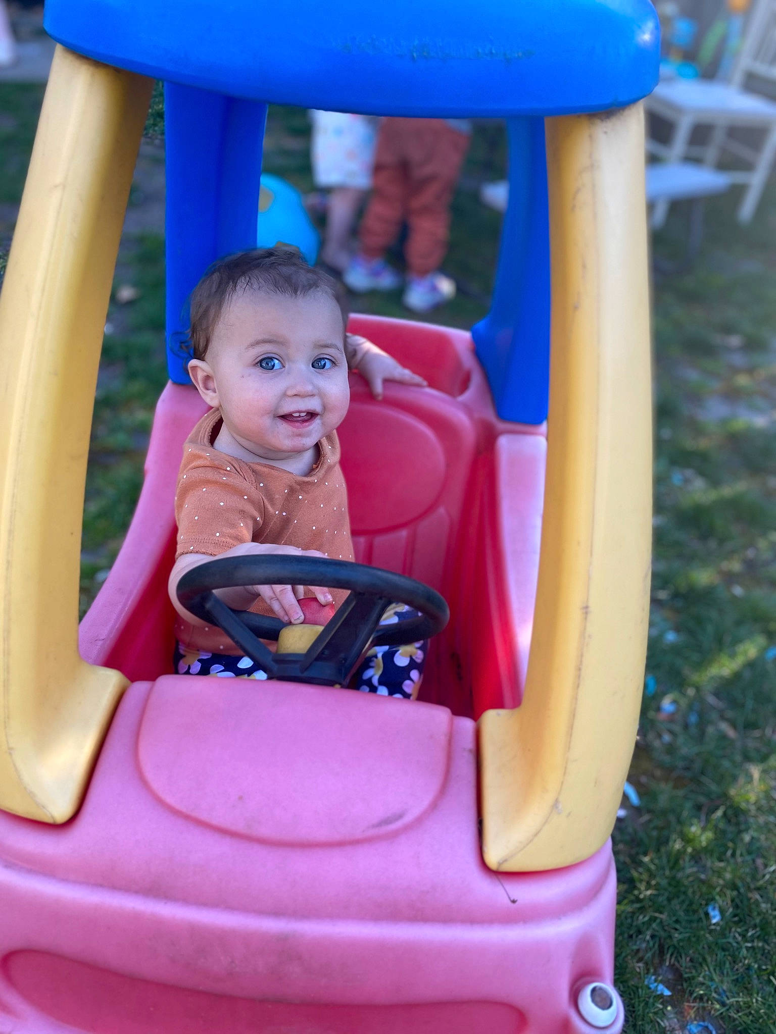 Gracelyn joined the competition — help win amazing prizes! automotive_exterior, baby_toddler_clothing, blue, fun, happy, head, joy, leisure, motor_vehicle, person, photograph, pink, purple, recreation, red, smile, summer, tire, toddler, wheel
