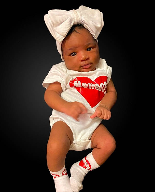 Honesty joined the competition — help win amazing prizes! baby, baby_toddler_clothing, event, face, fictional_character, flash_photography, happy, hat, head, headgear, human_body, human_leg, knee, person, sleeve, sock, sportswear, stomach, t_shirt, thigh