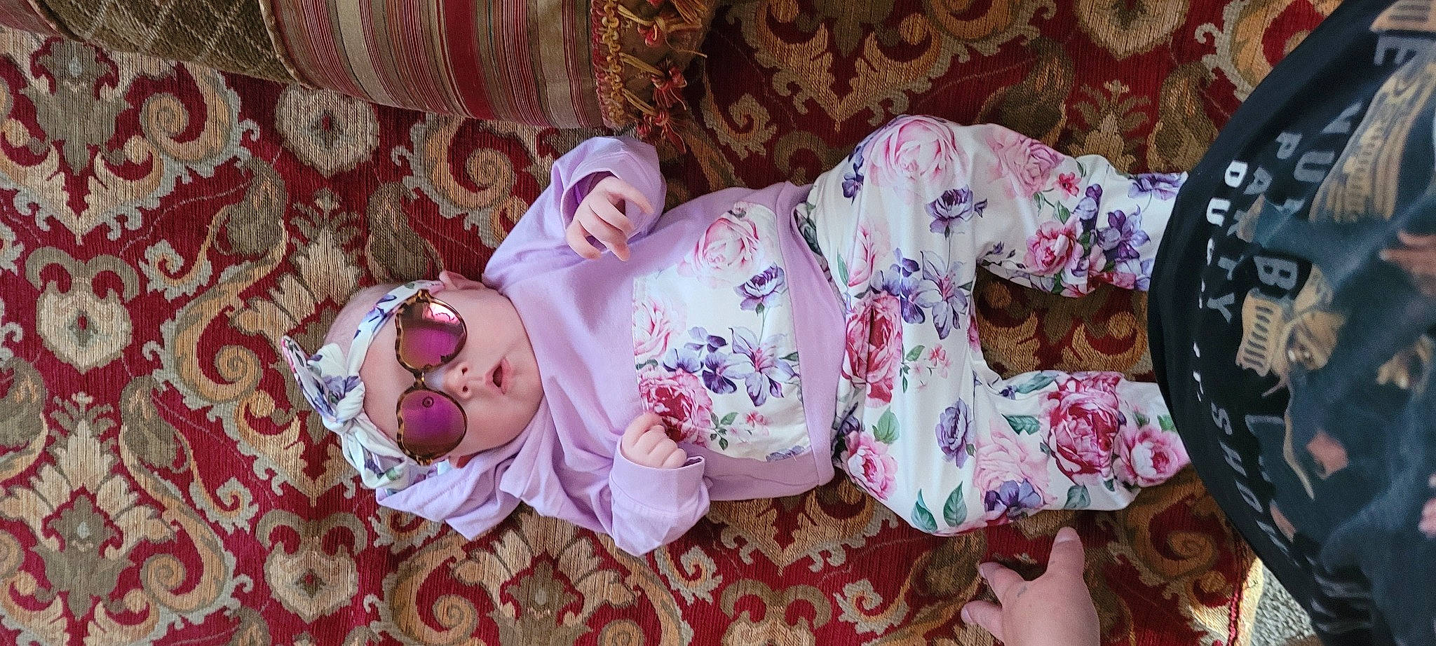 Thea is registered to the contest to win money with this photo: baby, baby_products, baby_toddler_clothing, child, comfort, curtain, headwear, linens, magenta, pattern, peach, person, pink, purple, room, rose, sleeve, textile, toddler, toy