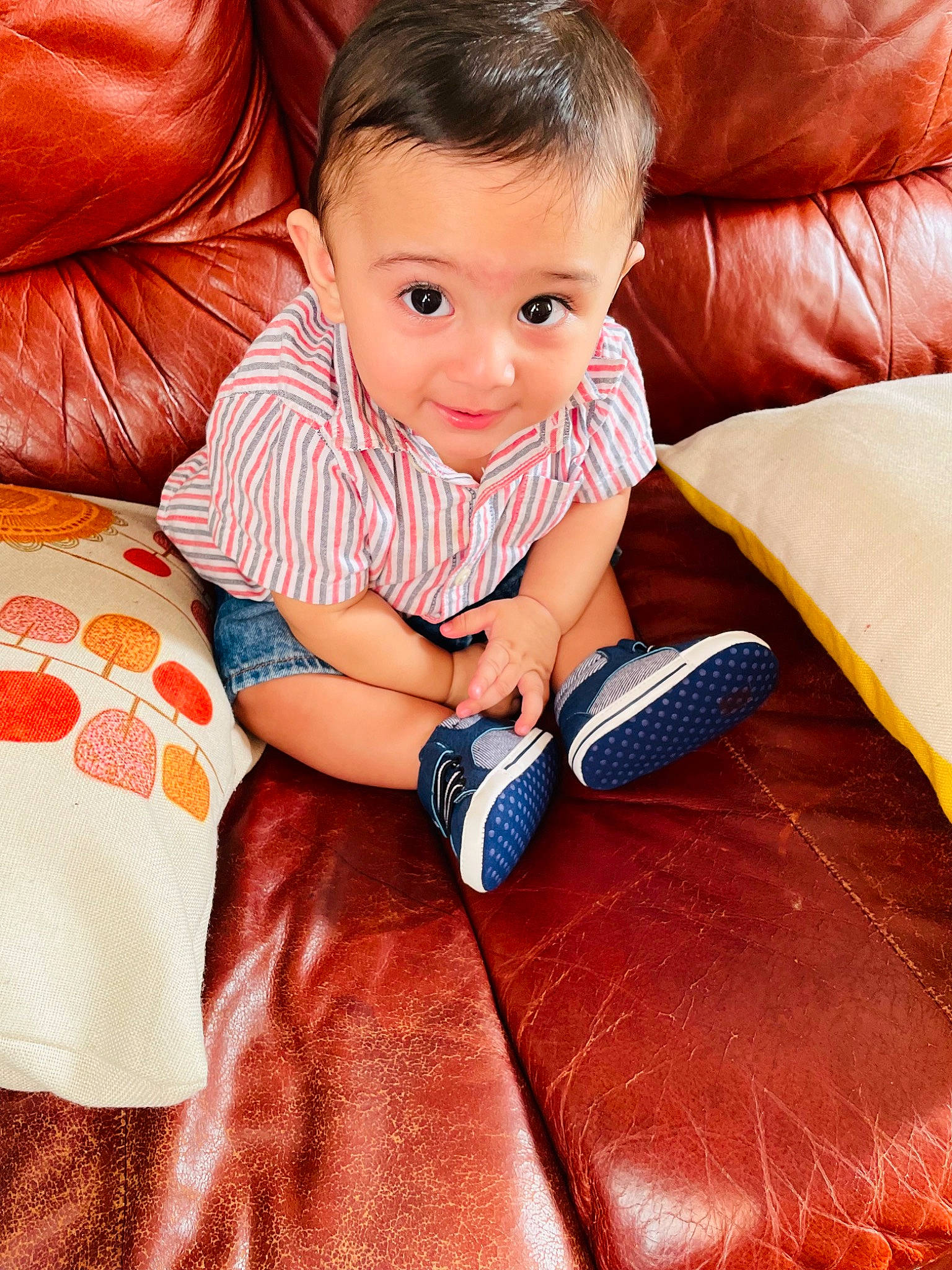 Ali joined the competition — help win amazing prizes! baby, baby_toddler_clothing, child, comfort, couch, eye, finger, flooring, happy, head, human_leg, lap, leg, orange, person, sitting, skin, smile, thigh, thumb