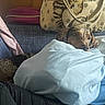 Betty Boo joined the competition — help win amazing prizes! bag, beige, blanket, blue, canine, coat, couch, dog, domestic_animal, fabric, furniture, indoor, jacket, living_room, pet, pillow, purple, relaxing, resting, spotted