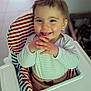 Roméo participe au concours pour gagner de l'argent avec cette photo : baby, cheerful, child, clothing, cute, expression, face, hands, happy, high_chair, home, indoor, infant, person, playful, seated, smile, striped_cushion, tongue_out, young_child
