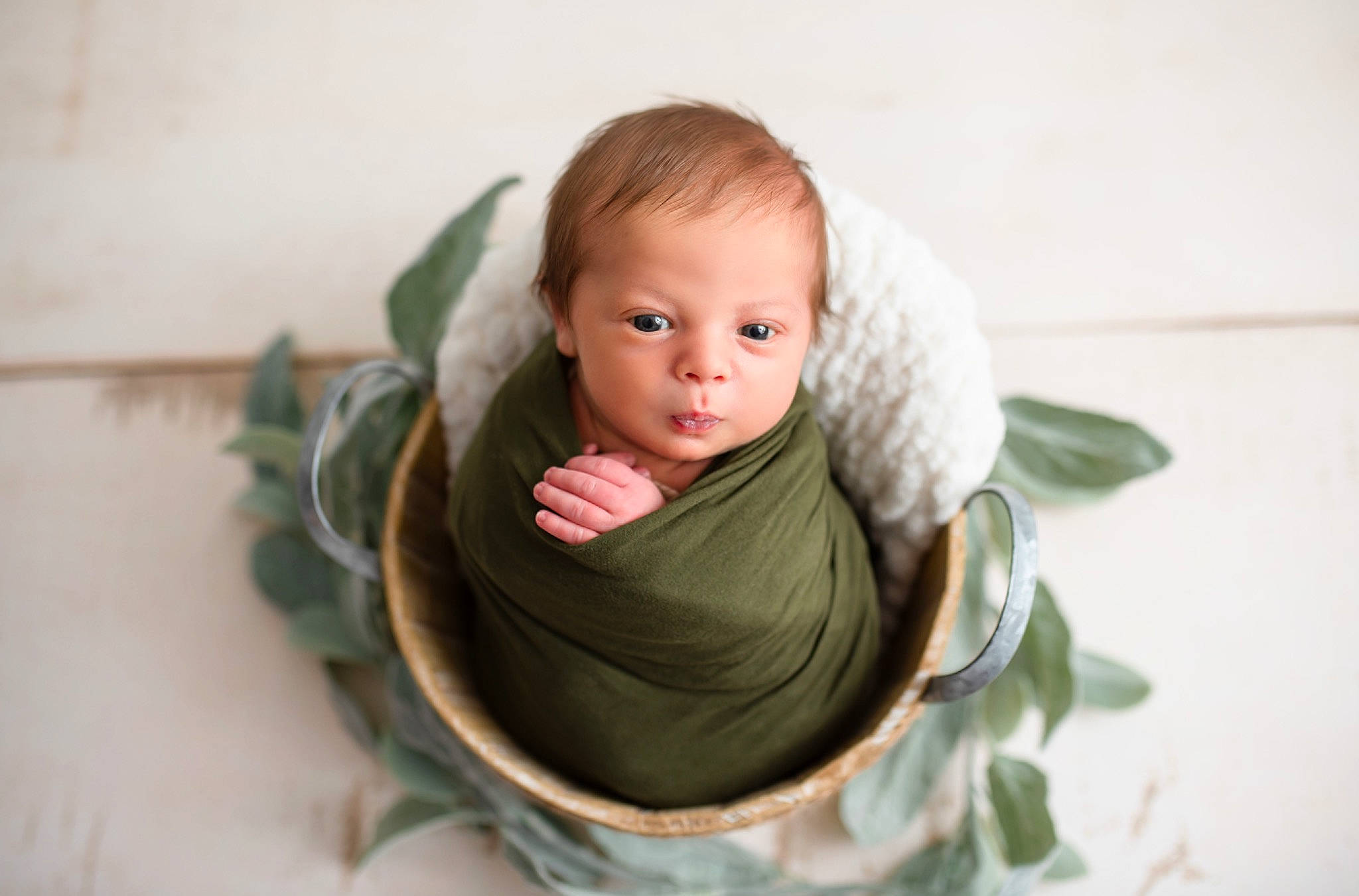 James is registered to the contest to win money with this photo: baby, child, comfort, dress, eye, eyelash, face, fashion_accessory, grass, hair, happy, human_body, jewellery, linens, lip, person, plant, room, sitting, toddler