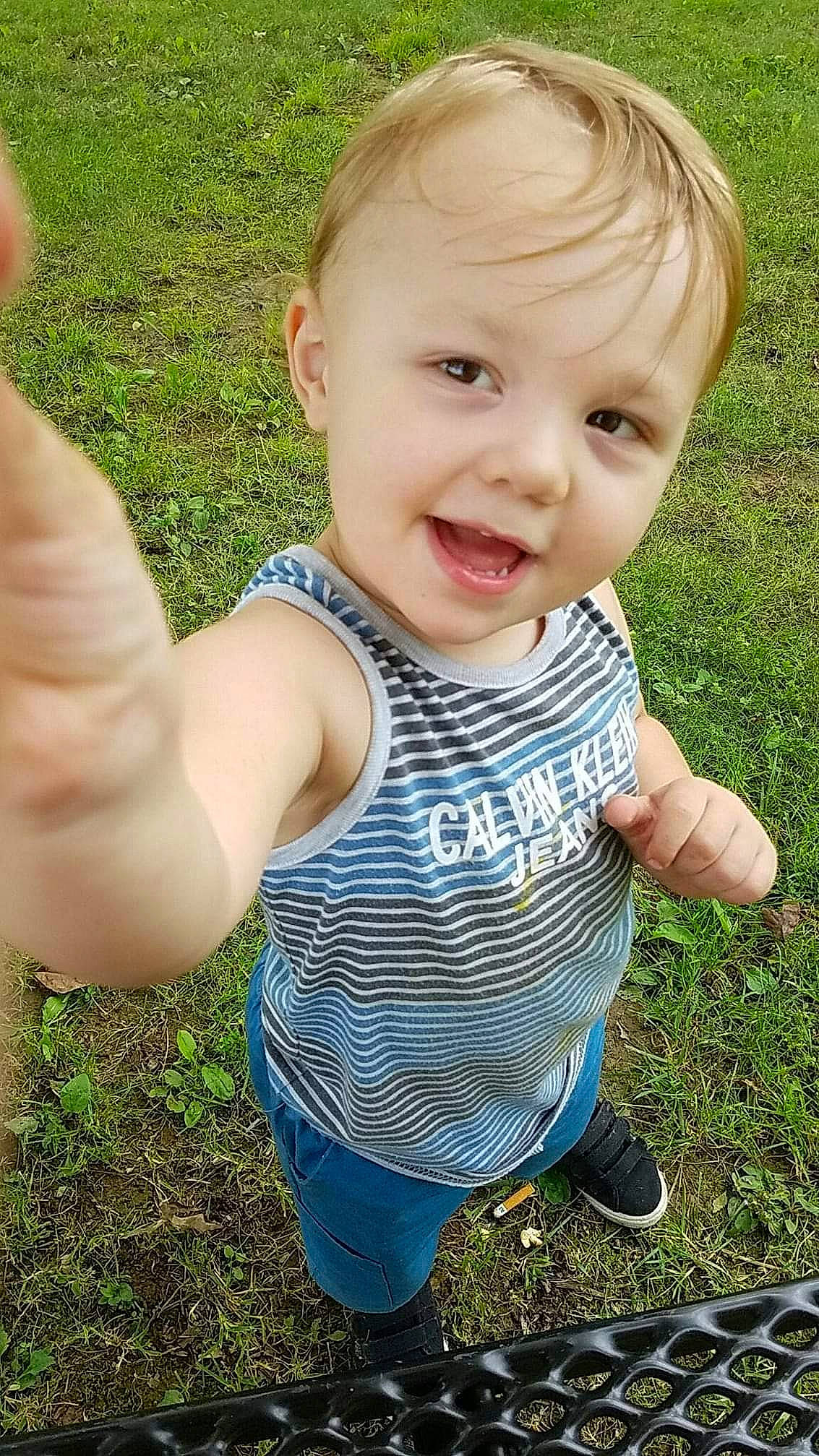 Aveon is registered to the contest to win money with this photo: arm, baby_toddler_clothing, face, facial_expression, finger, gesture, grass, hair, hairstyle, hand, happy, head, joint, leaf, people_in_nature, person, plant, skin, sleeve, smile