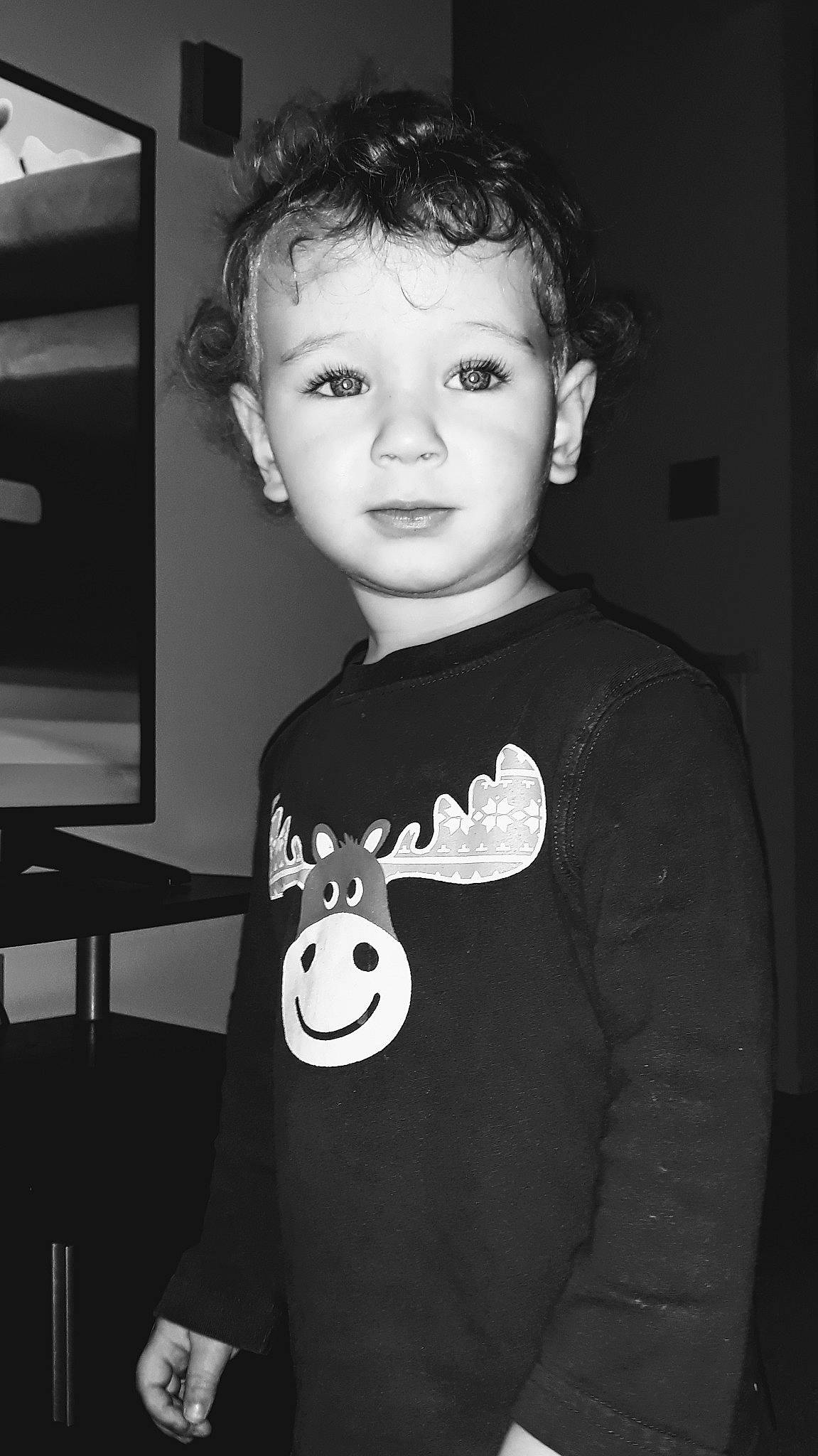 Benjamin joined the competition — help win amazing prizes! black_and_white, child, ear, face, head, monochrome, neck, person, smile, standing, t_shirt, toddler