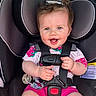 Layken joined the competition — help win amazing prizes! baby, car_interior, car_seat, child, cute, face, hair, hands, happy, human, indoor, infant, pink_clothing, playful, portrait, safety_harness, seatbelt, shorts, smiling, toddler