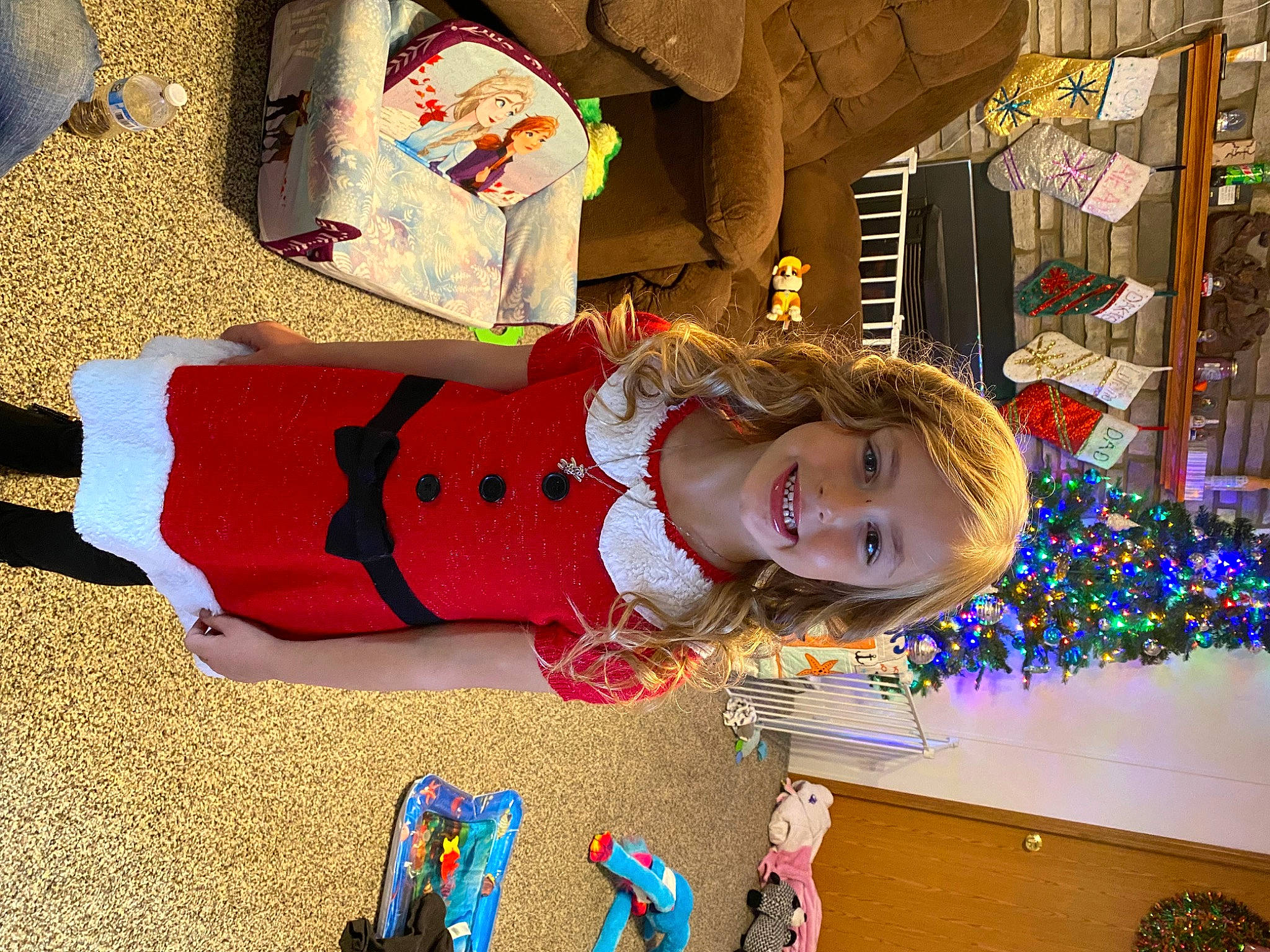Aleana is registered to the contest to win money with this photo: art, child, christmas, christmas_eve, event, flooring, fun, happy, holiday, joy, leisure, person, play, room, smile, textile, toddler, tree, visual_arts, wood