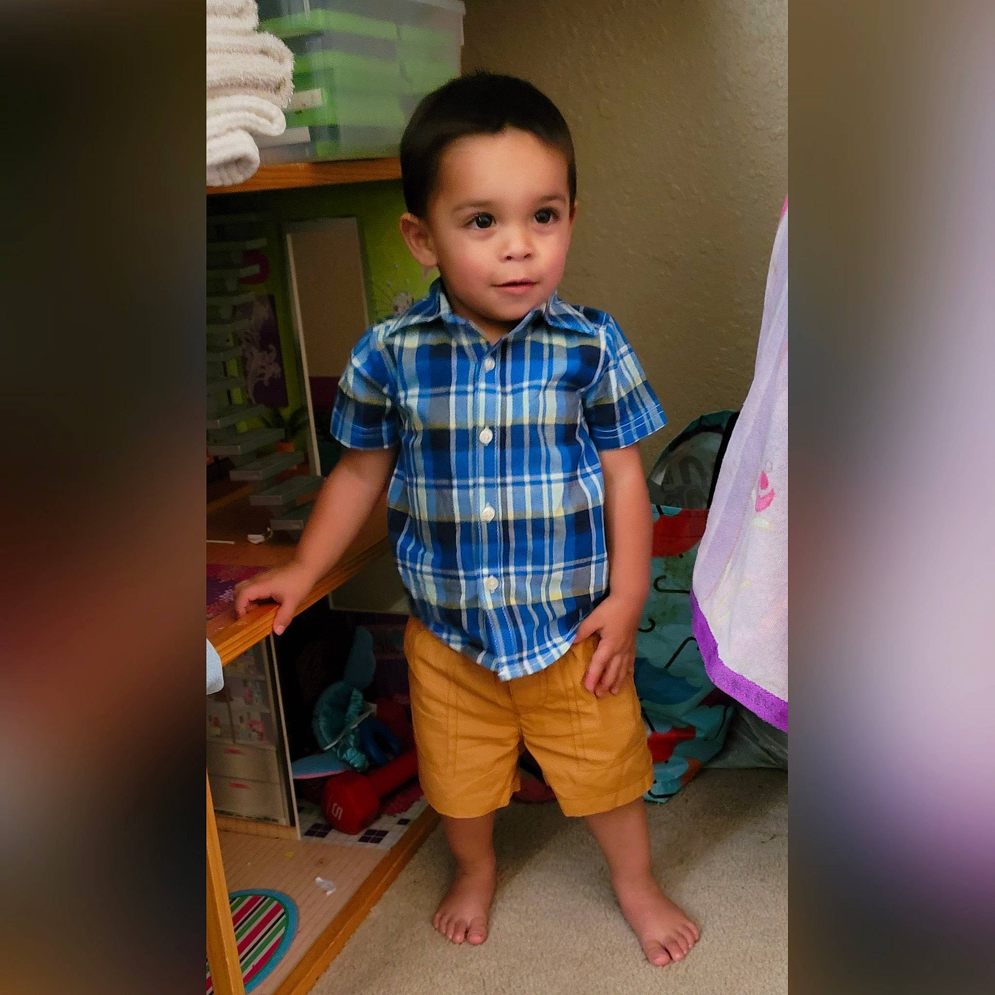 Alaric is registered to the contest to win money with this photo: baby_toddler_clothing, child, denim, electric_blue, flooring, fun, gadget, human_body, pattern, person, plaid, play, room, shelf, shoulder, sitting, sleeve, t_shirt, tartan, toddler