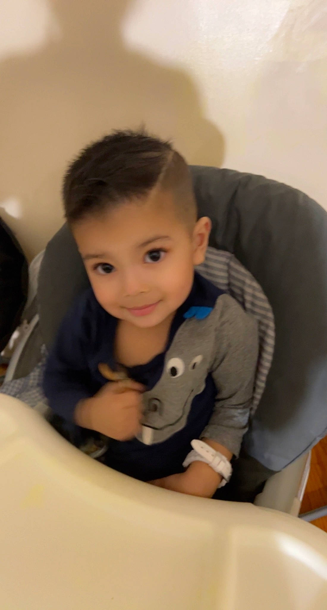 Aryan is registered to the contest to win money with this photo: arm, black_hair, chair, comfort, elbow, eyelash, finger, flash_photography, flooring, fun, human_body, human_leg, joy, knee, neck, person, room, sitting, sleeve, smile