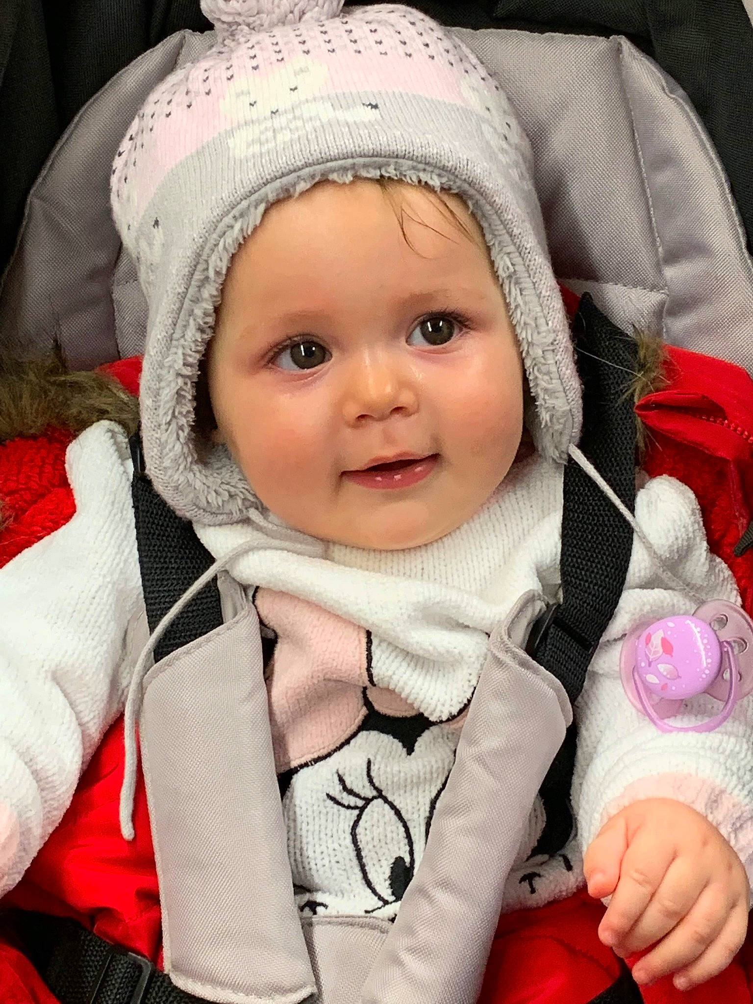 Cynthia participe au concours pour gagner de l'argent avec cette photo : beanie, bonnet, cap, car_seat, cheek, child, eye, girl, hat, headgear, infant, knit_cap, nose, person, product, red, skin, smile, textile, toddler