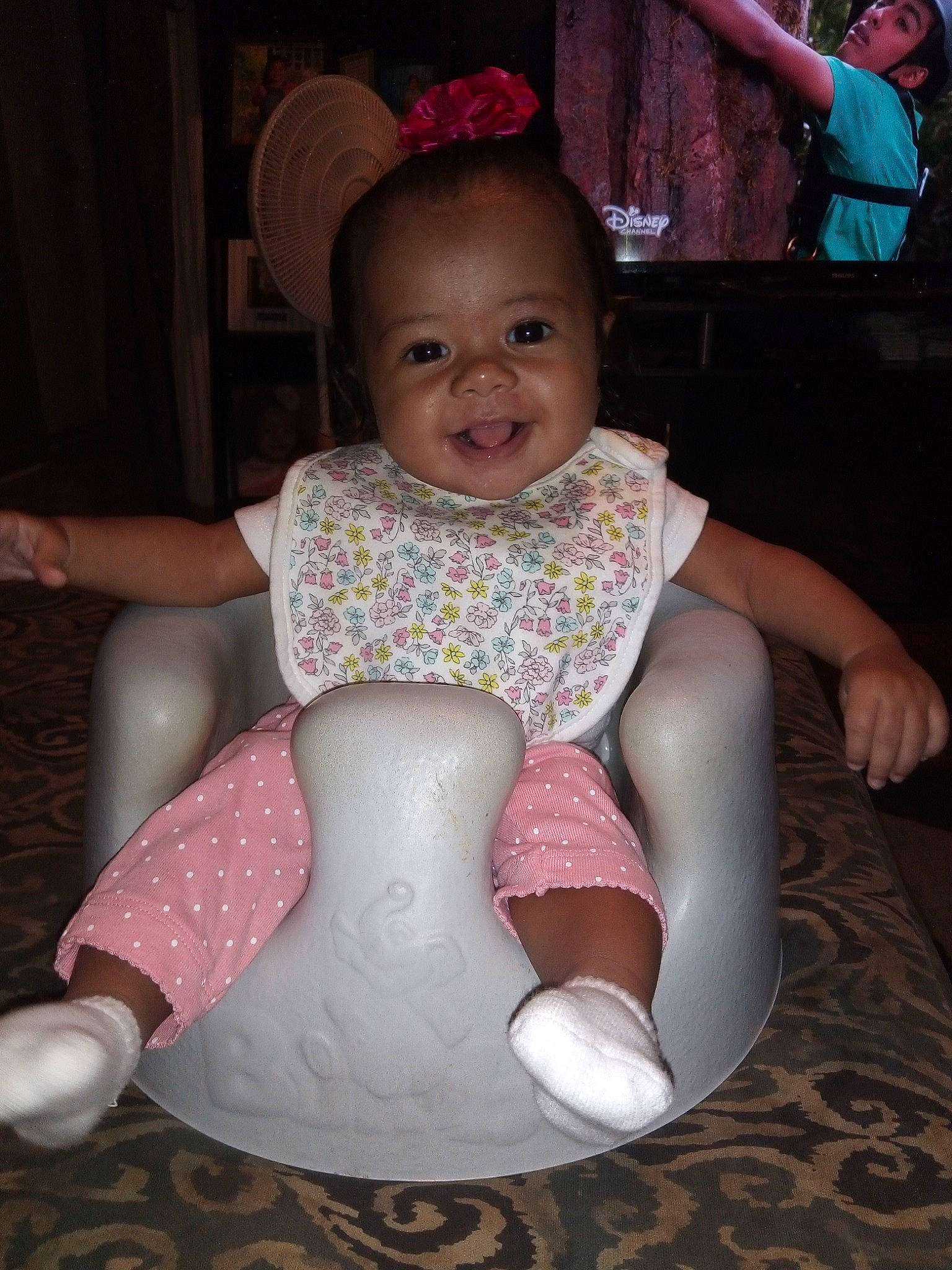 Aminah joined the competition — help win amazing prizes! baby, child, joy, person, pink, sitting, toddler