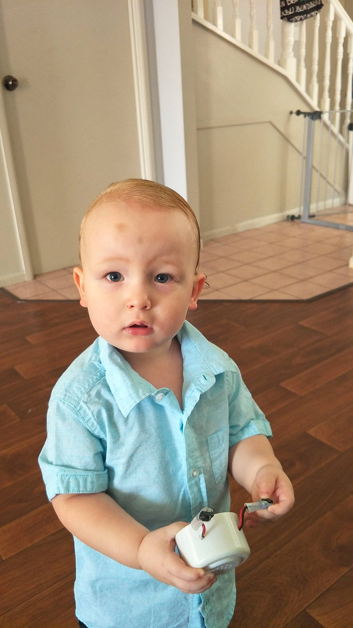 Luke is registered to the contest to win money with this photo: baby, child, floor, flooring, person, product, sitting, skin, smile, toddler, vacation, wood