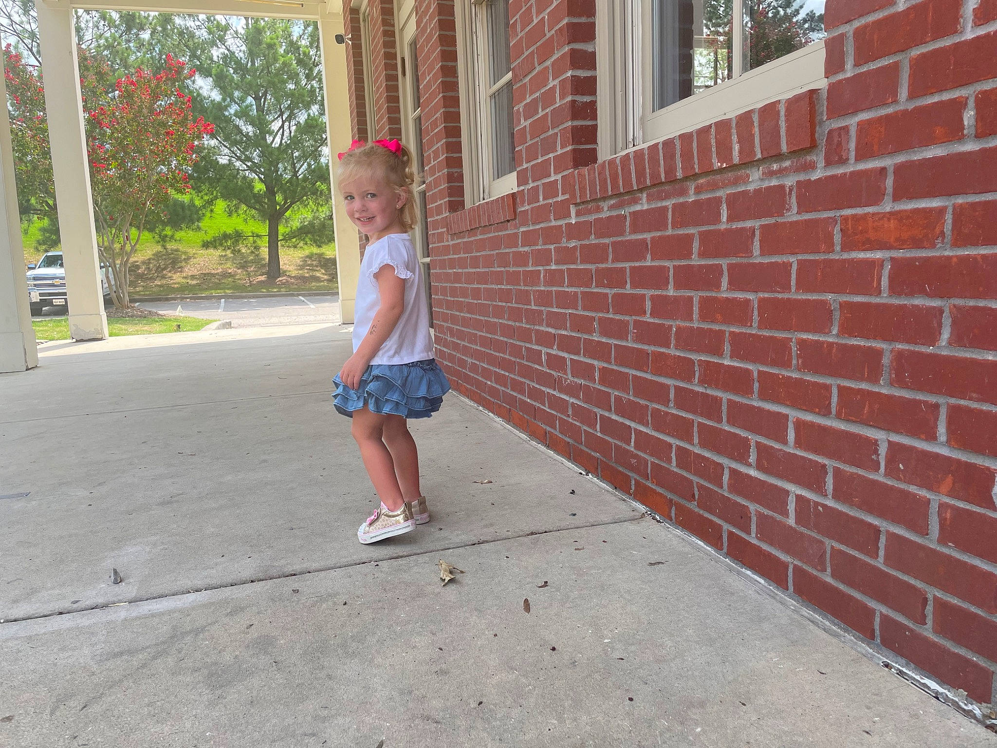 Maci is registered to the contest to win money with this photo: asphalt, brick, brickwork, city, concrete, electric_blue, flooring, grass, human_leg, human_settlement, joy, leisure, person, plant, public_space, recreation, road, road_surface, shorts, sidewalk