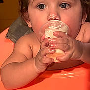 Benjamin joined the competition — help win amazing prizes! baby, child, face, hands, cream, food, messy, nose, highchair, orange, skin, closeup, cute, indoor, infant, expression, small_hands, young_child, dairy, eating