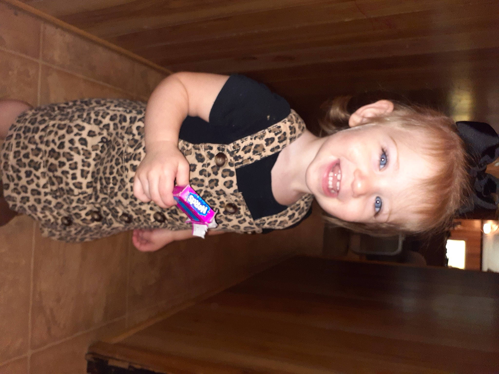 Delaney joined the competition — help win amazing prizes! arm, dress, eye, face, fawn, flash_photography, flooring, fun, hair, happy, hardwood, head, human_leg, joy, pattern, person, smile, thigh, toddler, varnish