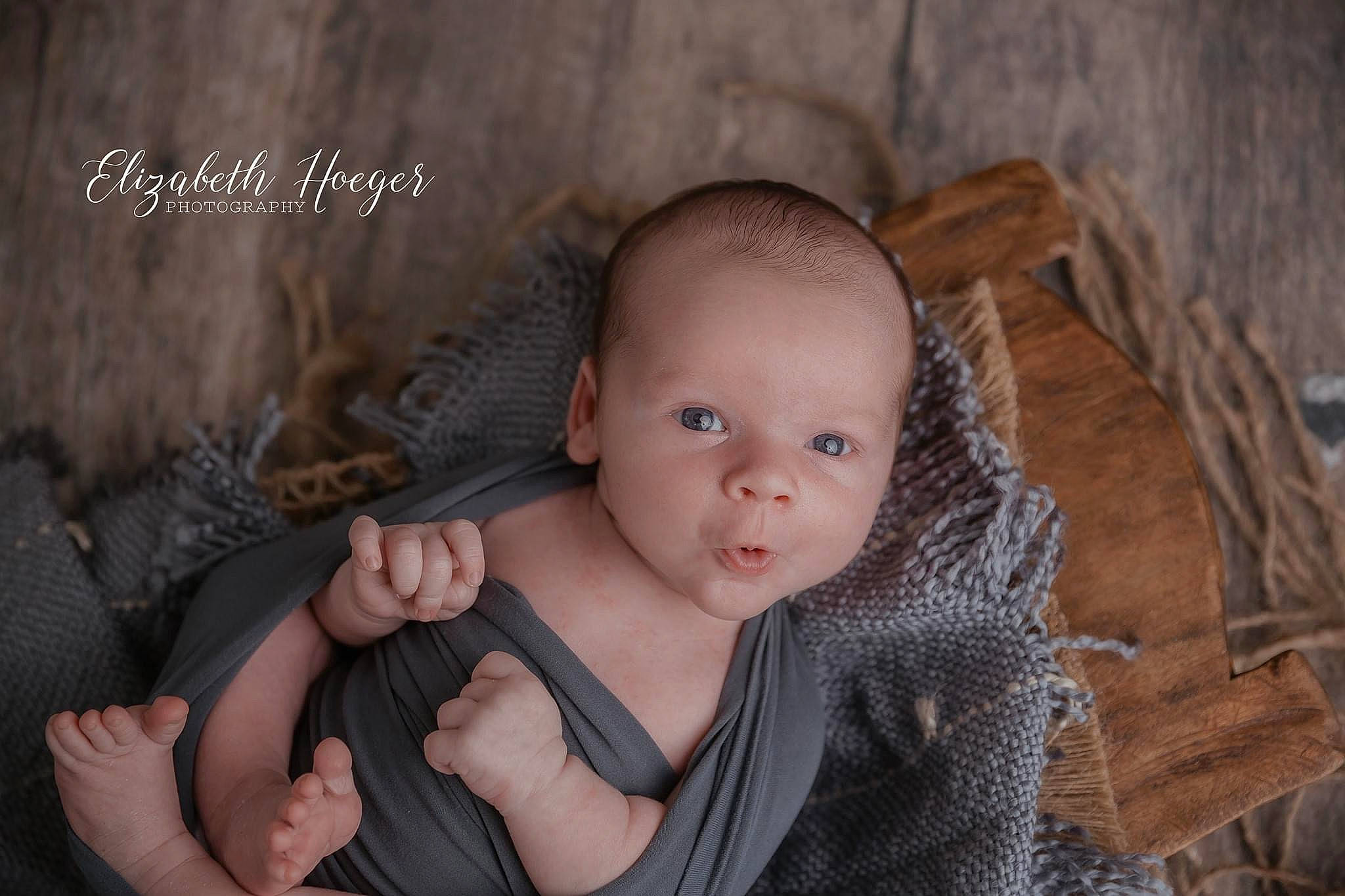 Warren is registered to the contest to win money with this photo: baby, baby_toddler_clothing, cheek, comfort, eye, eyelash, finger, flash_photography, gesture, hand, happy, human_body, iris, lip, nose, person, sitting, skin, toddler, trunk