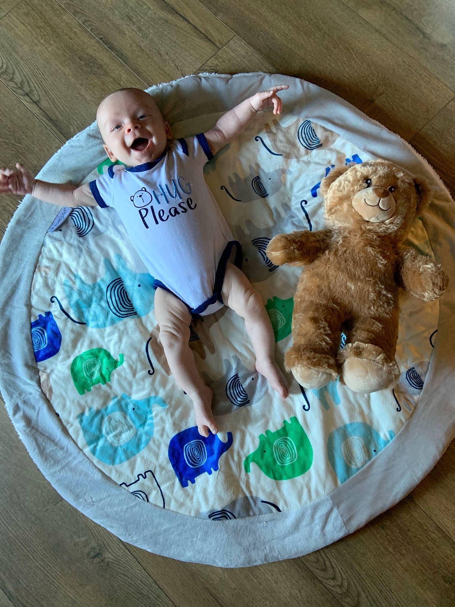 Warren is registered to the contest to win money with this photo: baby_products, baby_toys, child, comfort_food, companion_dog, fawn, font, grass, linens, pattern, person, plastic, plush, product, room, sporting_group, stuffed_toy, t_shirt, teddy_bear, textile