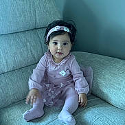 Kamila joined the competition — help win amazing prizes! baby, child, girl, purple_clothing, headband, sitting, couch, indoor, cute, smiling, portrait, toddler, long_sleeves, tights, fabric, furniture, person, young_child, home, cozy