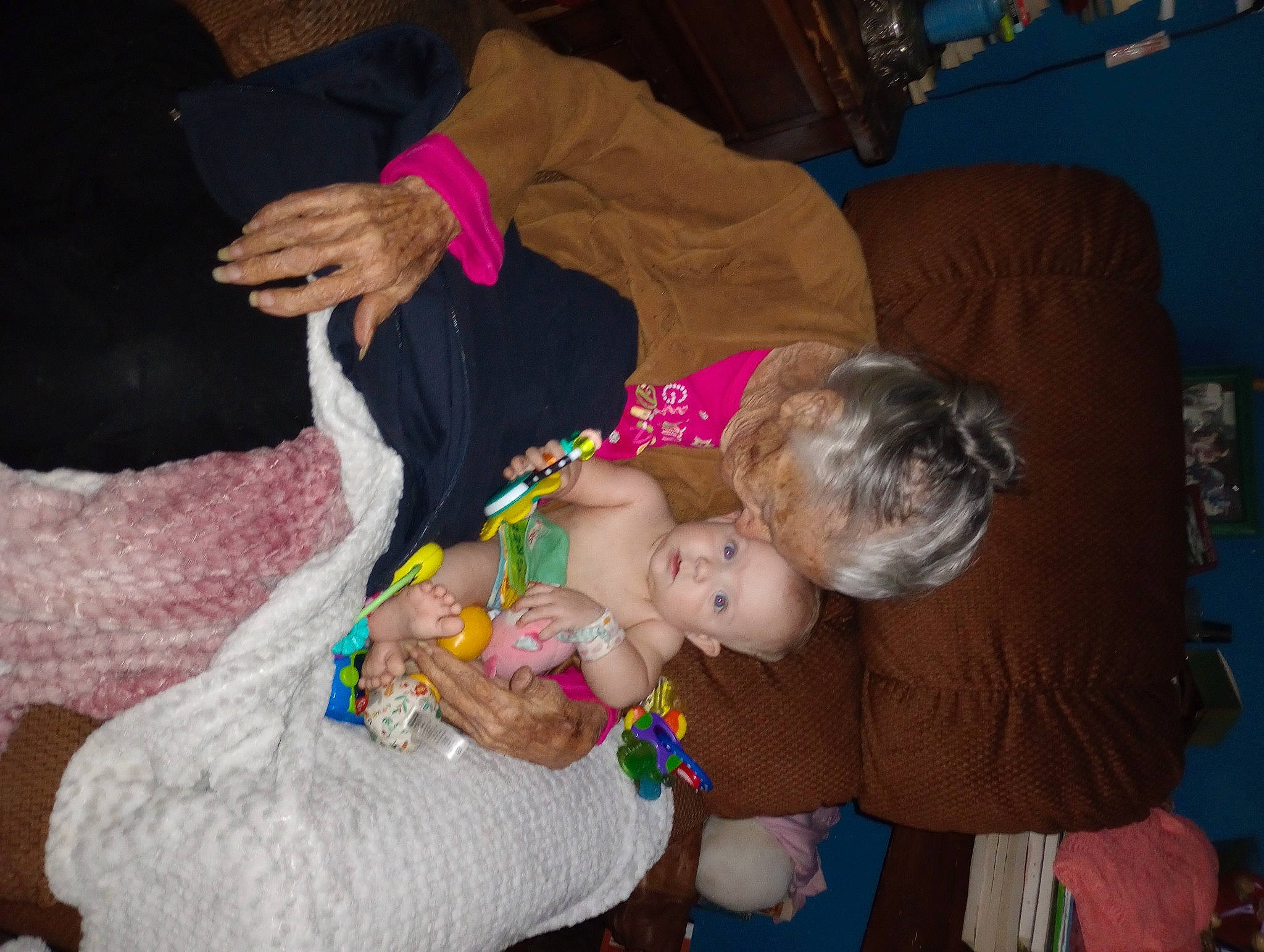 Paislee is registered to the contest to win money with this photo: baby, baby_products, baby_toddler_clothing, child, comfort, couch, event, finger, fun, happy, iris, lap, nail, party, person, picture_frame, room, sitting, toddler