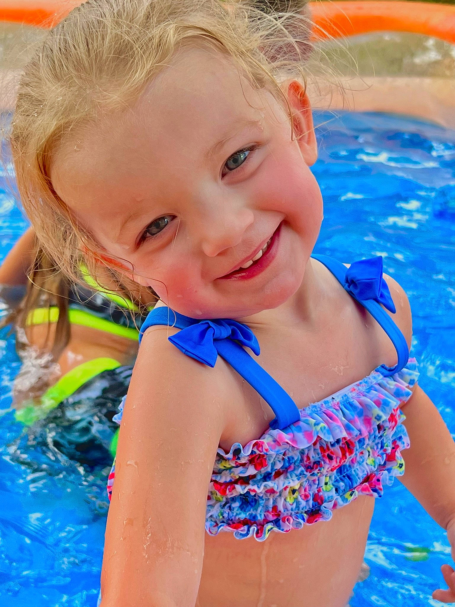 Lexi joined the competition — help win amazing prizes! aqua, azure, blue, child, electric_blue, face, facial_expression, fun, hair, happy, joy, leisure, one_piece_swimsuit, person, recreation, smile, summer, swimming_pool, swimwear, thigh