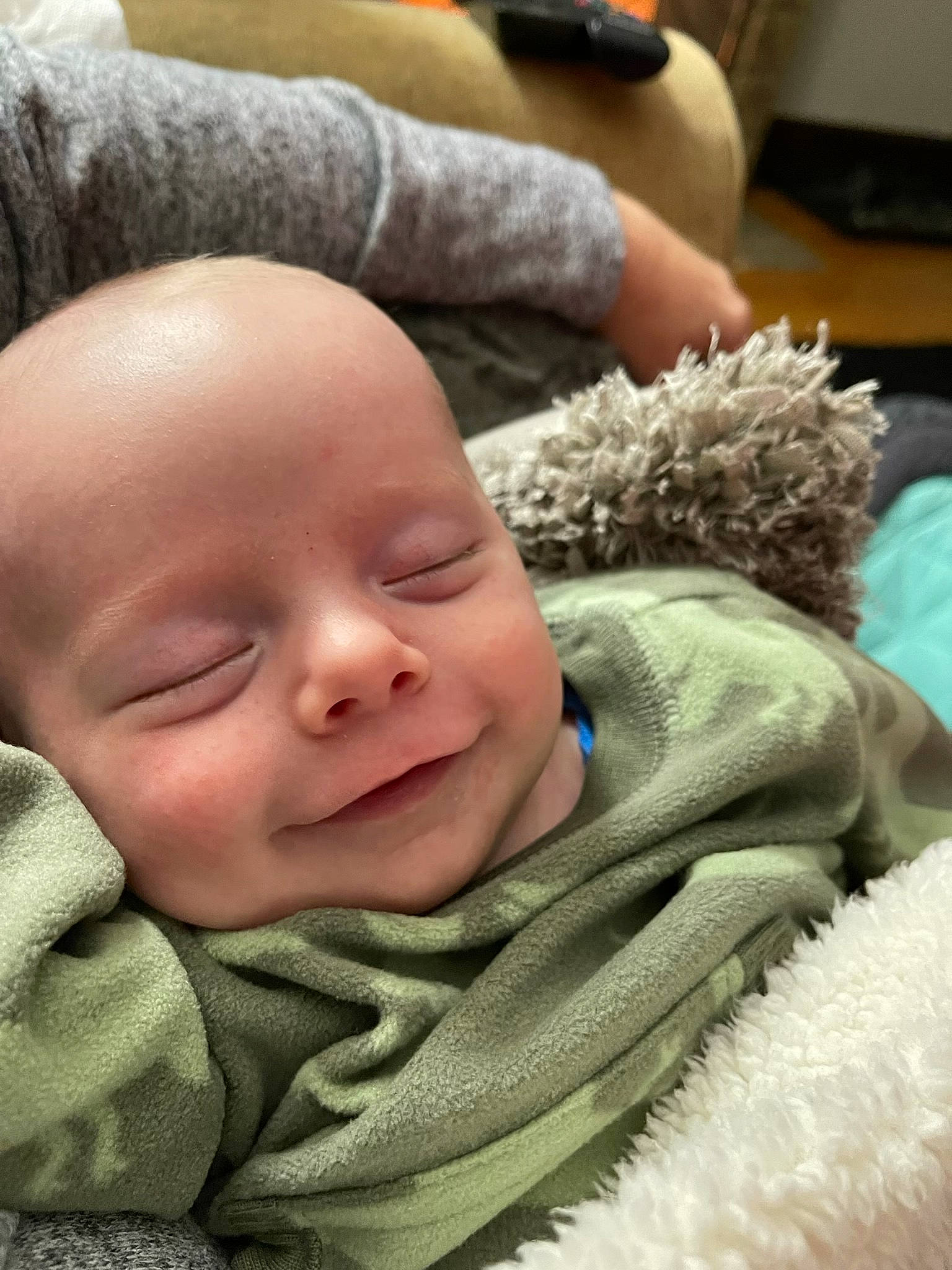 Archer is registered to the contest to win money with this photo: baby, baby_products, baby_toddler_clothing, cheek, child, comfort, fur, grass, happy, head, laugh, linens, mammal, person, sitting, skin, smile, toddler, vertebrate, wool