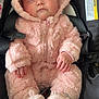 Mila is registered to the contest to win money with this photo: baby, infant, sleeping, car_seat, pink_outfit, hooded_onesie, plush_texture, booties, knit_booties, peaceful, portrait, close_up, hands, buckle, safety_label, soft_fabric, cozy, eyelashes, cheeks, newborn