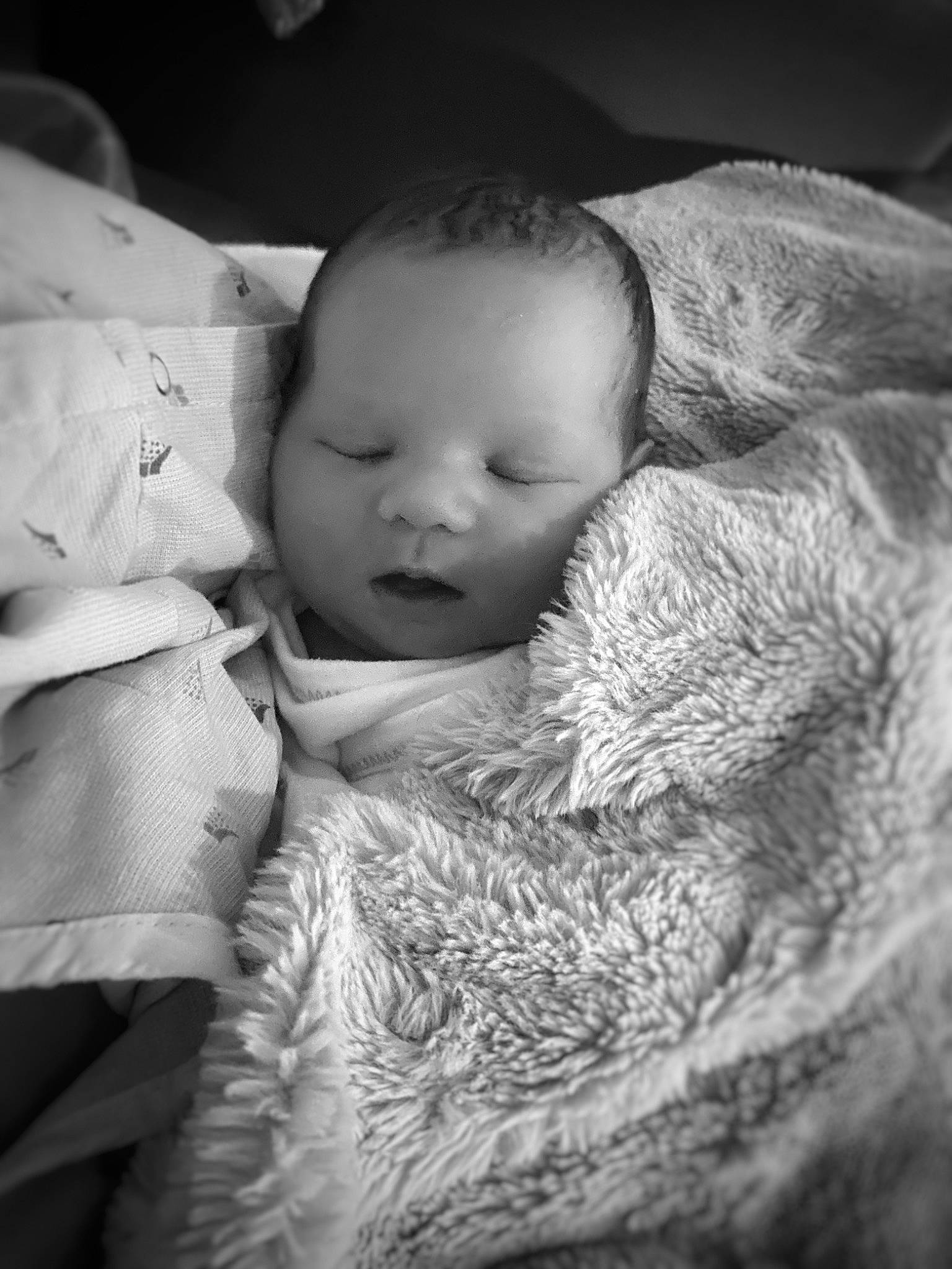 Ayvah is registered to the contest to win money with this photo: baby, bedtime, black_and_white, cheek, close_up, cloud, comfort, eye, flash_photography, gesture, grass, happy, iris, lip, monochrome, monochrome_photography, nose, person, skin, textile