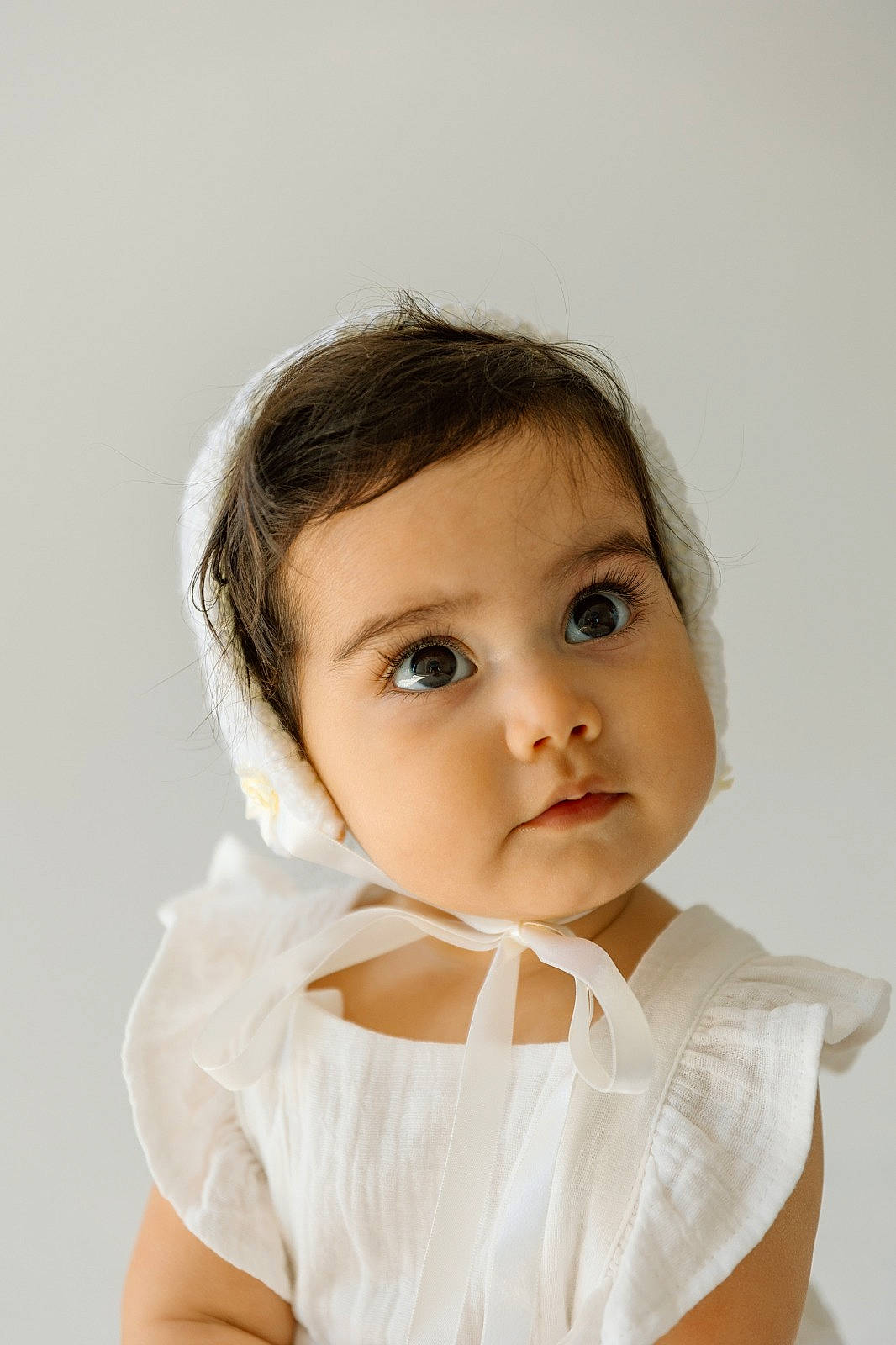 Jaiya is registered to the contest to win money with this photo: baby, baby_toddler_clothing, bridal_accessory, cheek, child, collar, comfort, eyelash, face, flash_photography, fur, happy, linens, lip, neck, no_expression, person, portrait_photography, sitting, sleeve