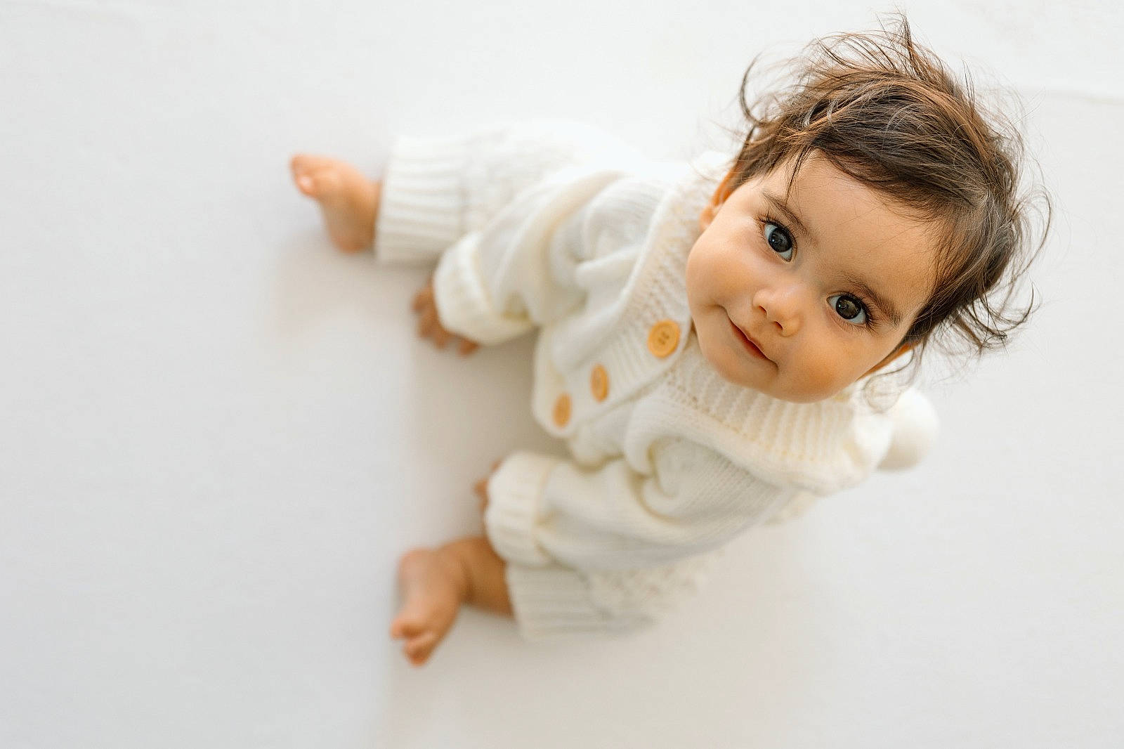 Jaiya is registered to the contest to win money with this photo: baby, baby_toddler_clothing, cheek, child, doll, eyelash, foot, fur, gesture, happy, iris, person, portrait_photography, sitting, sleeve, thumb, toddler, toy, wood, wrist