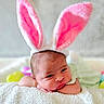 baby, newborn, bunny_ears, pink, white, blanket, soft_texture, cute, portrait, infant, headwear, easter, pastel_colors, resting, face, sleepy, indoors, young_child, colorful, holiday