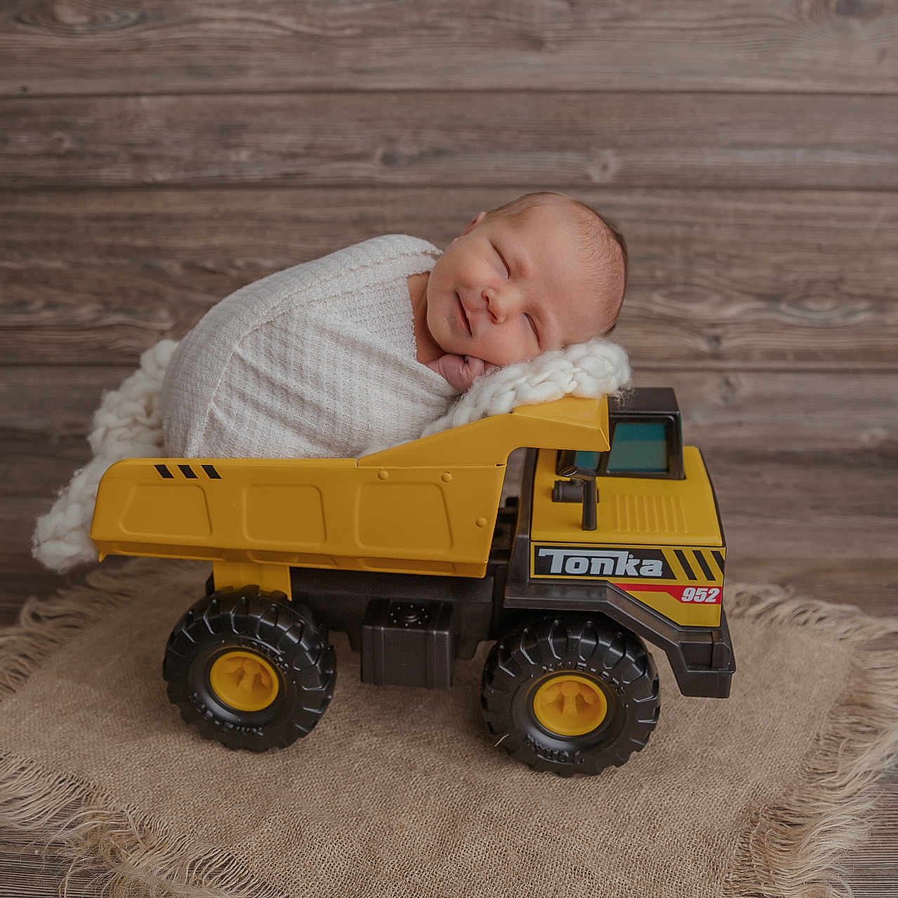 Maddox joined the competition — help win amazing prizes! alloywheel, baby, blanket, car, carwheel, face, hardwood, head, machine, newborn, person, photography, portrait, spoke, tire, toy, transportation, vehicle, wheel, wood