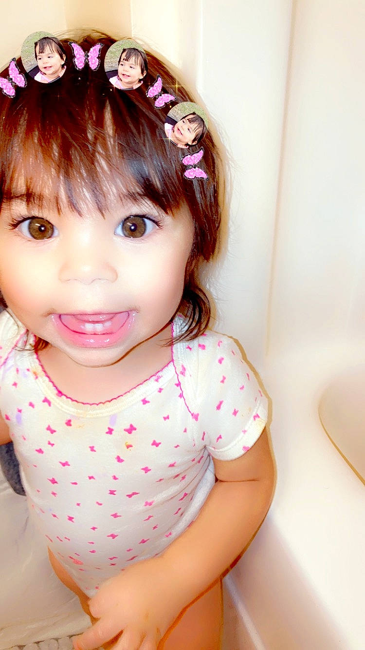 Adalina is registered to the contest to win money with this photo: baby_toddler_clothing, bangs, cheek, chin, dress, ear, eyebrow, eyelash, finger, hair, happy, head, joy, lip, neck, person, pink, shoulder, skin, sleeve