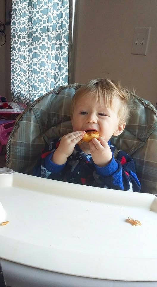 Michael is registered to the contest to win money with this photo: baby, cheek, child, eating, face, food, nose, person, sitting, skin, toddler, vacation