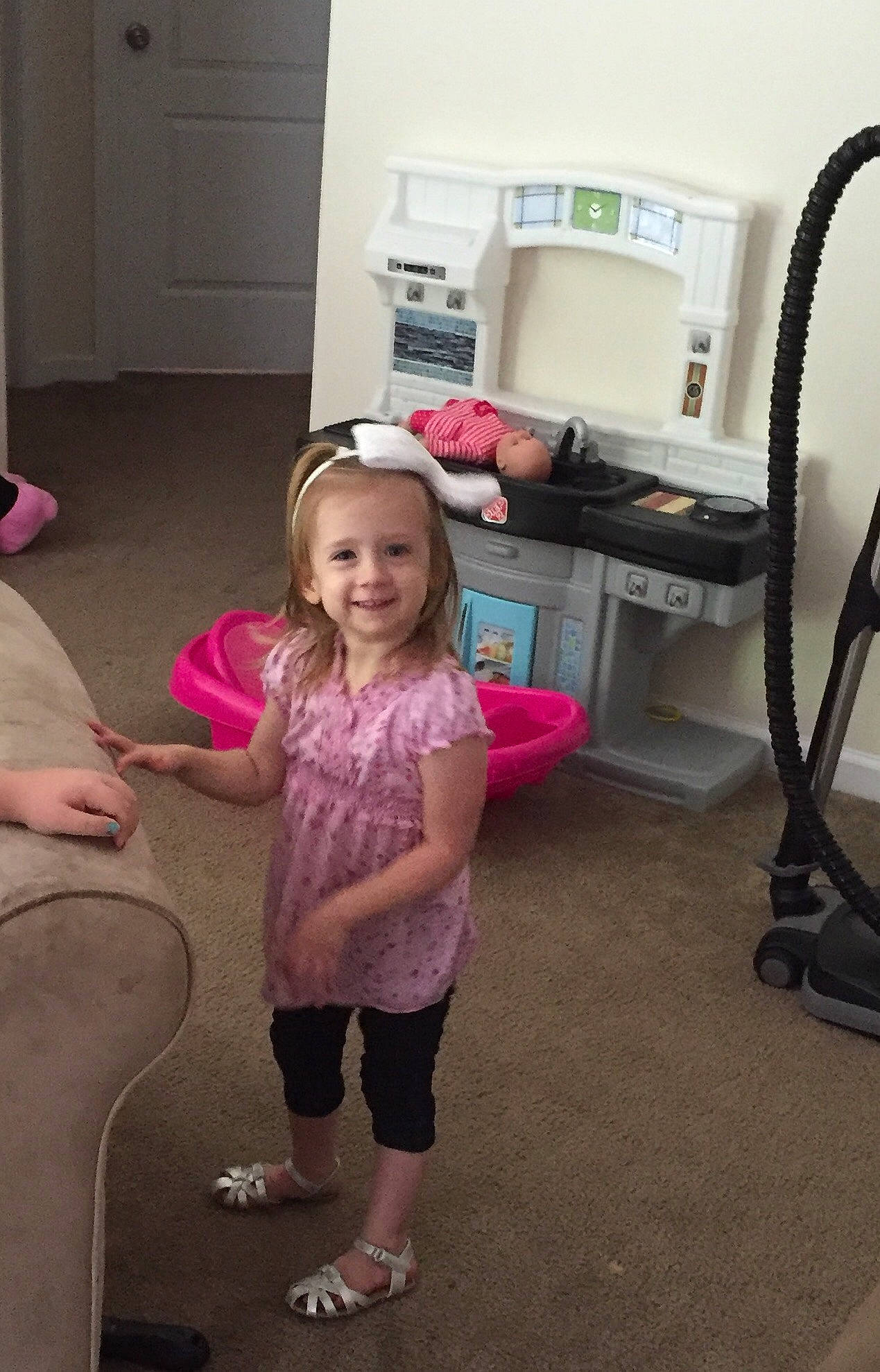 Brie joined the competition — help win amazing prizes! arm, chair, child, floor, flooring, fun, joint, joy, leg, person, pink, play, room, shoulder, skin, smile, standing, toddler