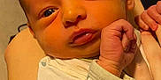Koda is registered to the contest to win money with this photo: arm, baby, bodypart, face, finger, frown, hand, happy, head, newborn, person, photography, portrait, sad, shoulder, skin, smile