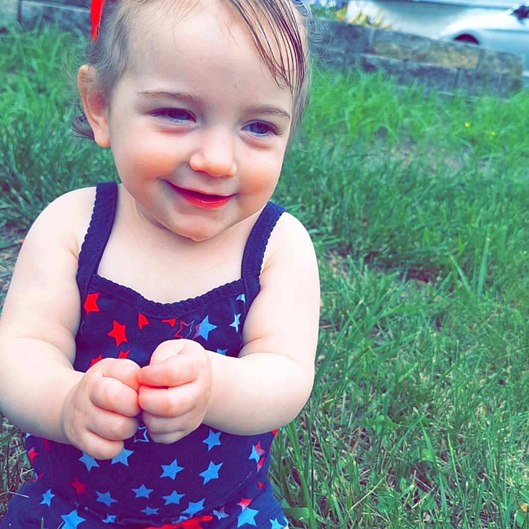 Grace is registered to the contest to win money with this photo: baby, backyard, bodypart, car, clothing, dress, face, finger, grass, hand, head, lawn, nature, outdoors, person, photography, plant, portrait, summer, yard