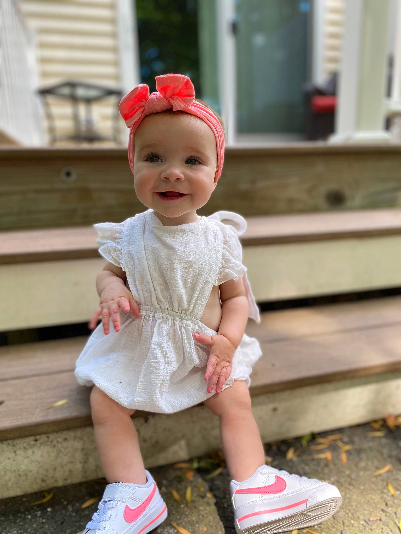 Lily is registered to the contest to win money with this photo: baby, baby_toddler_clothing, cap, child, fashion_accessory, footwear, fun, grass, happy, headwear, human_leg, joy, knee, person, pink, shoe, shorts, sleeve, smile, sneakers