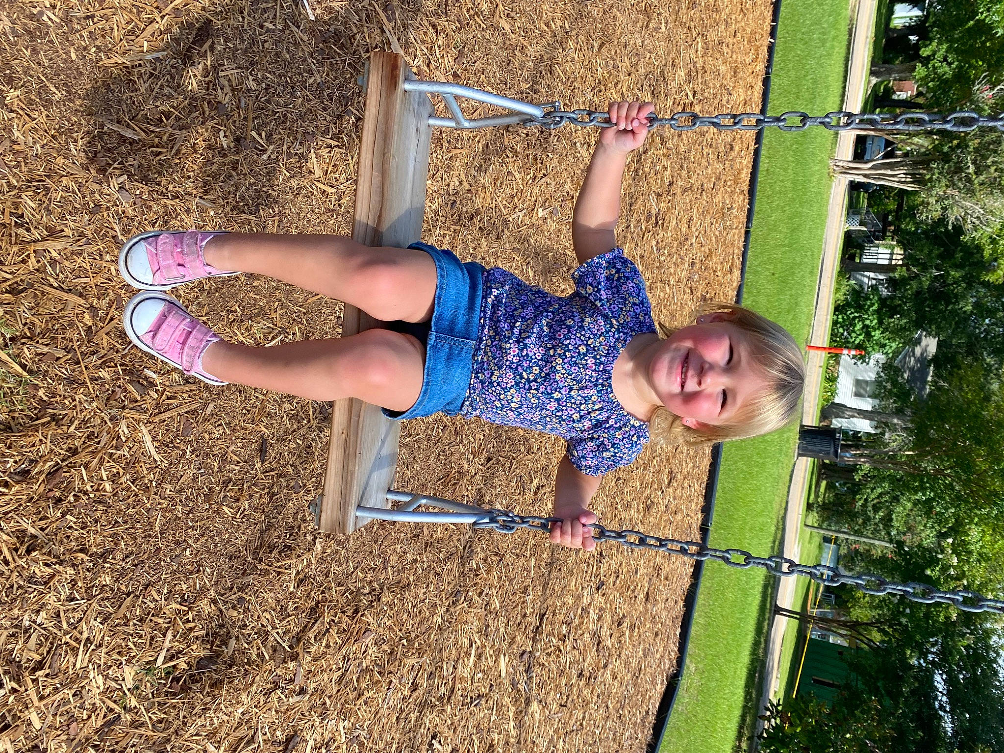 Everleigh is registered to the contest to win money with this photo: balance, calf, elbow, electric_blue, fun, grass, happy, human_leg, human_settlement, joy, knee, leisure, people_in_nature, person, playground, public_space, recreation, shorts, soil, thigh