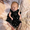 Madison is registered to the contest to win money with this photo: baby, infant, smiling, black_dress, sparkles, blanket, pink, soft_texture, hand, sleeping, peaceful, cute, newborn, skin, foot, arm, person, portrait, cozy, resting