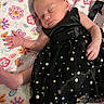 Madison is registered to the contest to win money with this photo: baby, newborn, sleeping, dress, black_dress, sparkles, blanket, floral_pattern, infant, peaceful, cute, small_hands, small_feet, indoors, portrait, sleep, child, adorable, resting, soft