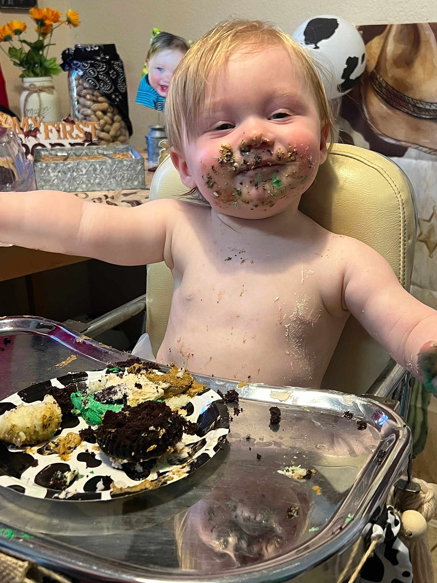 Onyx is registered to the contest to win money with this photo: arms_outstretched, birthday, cake, celebration, cheeks, child, crumbs, dirtied, food, frosting, fun, happy, high_chair, indoor, messy_face, person, plate, smile, toddler, young_child