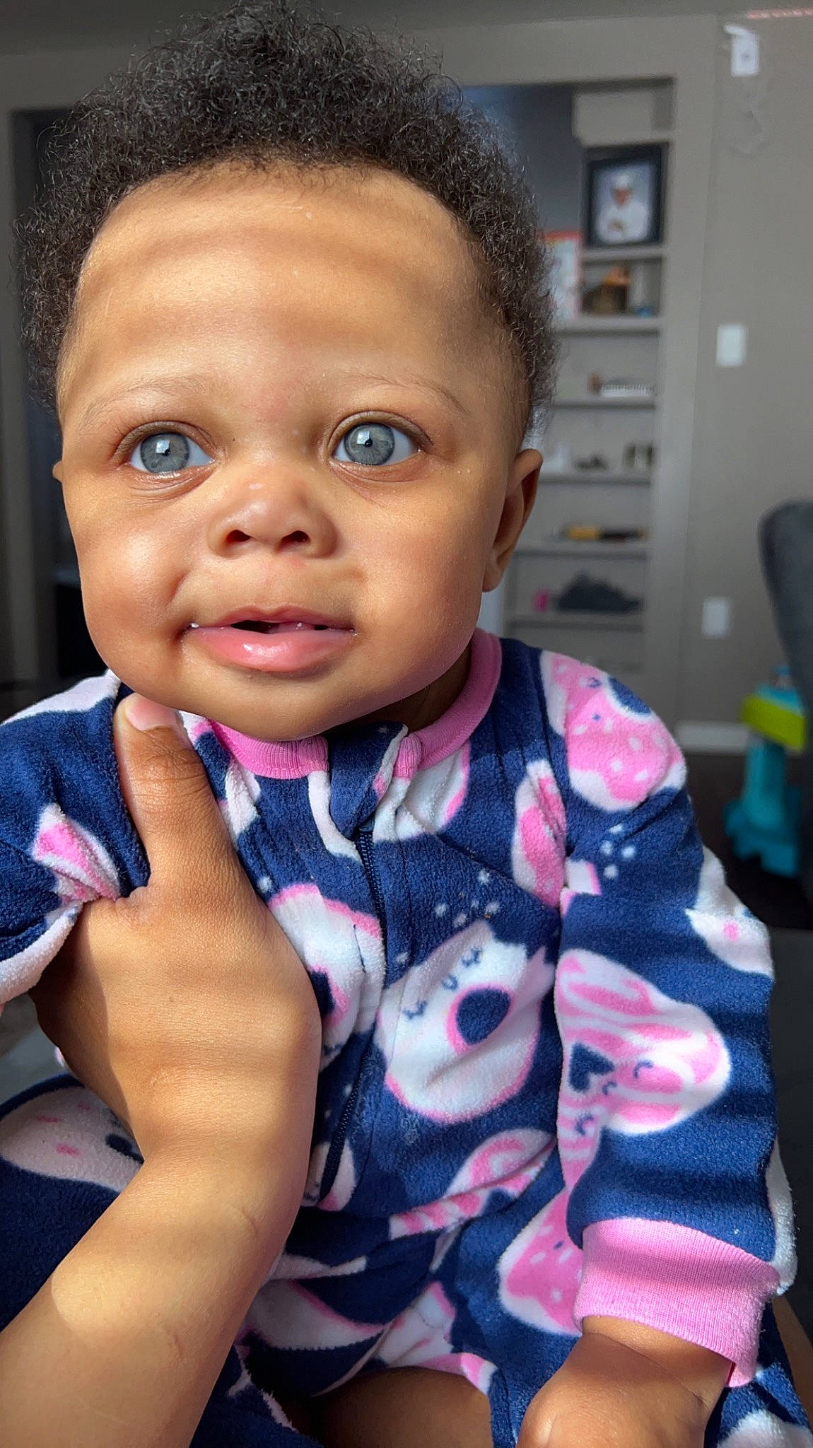 Jaliyah is registered to the contest to win money with this photo: baby_toddler_clothing, black_hair, cheek, chin, dress, ear, eyebrow, eyelash, finger, forehead, gesture, happy, iris, lip, nose, people, person, skin, sleeve, thumb