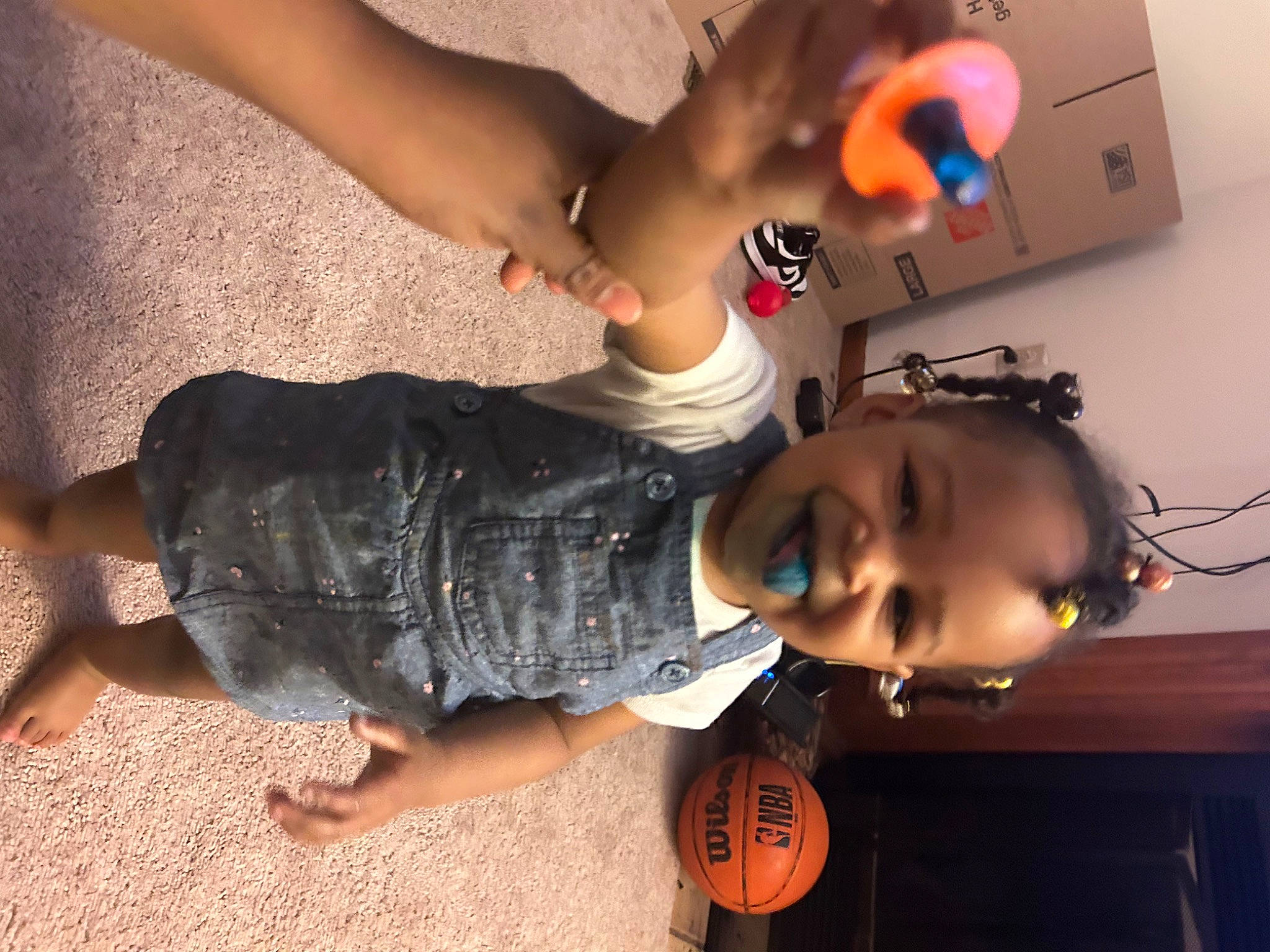 Ablessing Simpson is registered to the contest to win money with this photo: ball, child, dress, elbow, eyewear, finger, flooring, foot, fun, gesture, happy, human_leg, joy, leg, mouth, person, smile, sunglasses, thigh, toddler