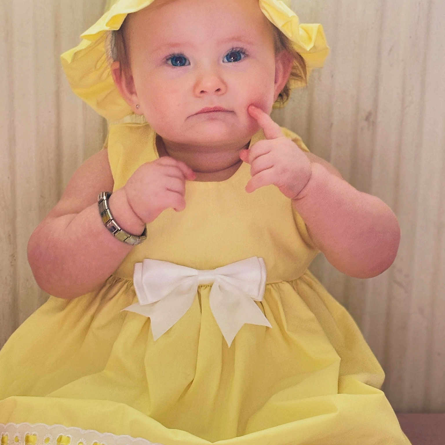 Amayah-Rae is registered to the contest to win money with this photo: accessories, baby, bodypart, bonnet, clothing, coat, costume, dress, face, finger, formalwear, hand, hat, head, jewelry, person, photography, portrait, sunhat, wristwatch