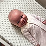 baby, blanket, child, comfort, cozy, cute, happy, head, indoor, infant, lying_down, newborn, nursery, onesie, portrait, skin, sleepwear, small_hands, smiling, soft_texture