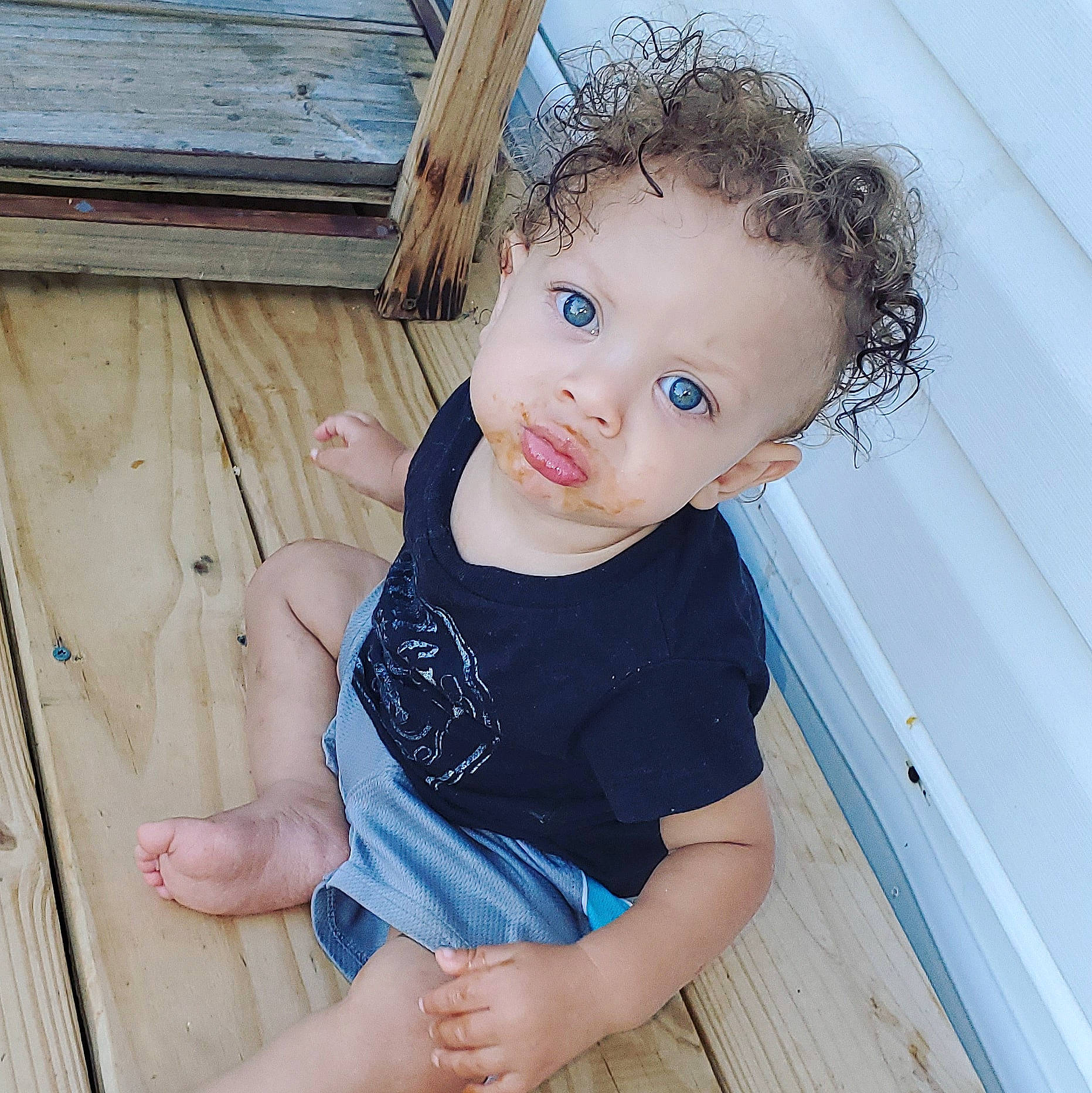 Preston is registered to the contest to win money with this photo: baby_toddler_clothing, beauty, brown_hair, cheek, child, child_model, chin, eye, hair, iris, nose, person, play, skin, standing, t_shirt, toddler, wood