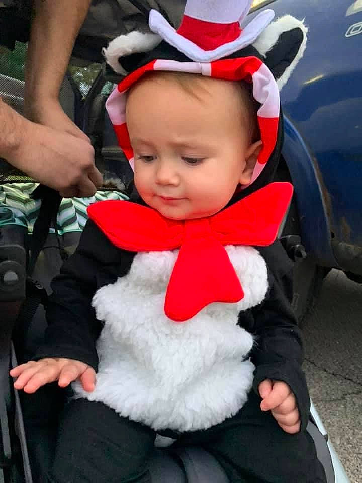 Jay joined the competition — help win amazing prizes! baby, black, car, carmine, costume_hat, event, fictional_character, fun, fur, fur_clothing, hat, headgear, hood, person, plant, red, santa_claus, shorts, toddler, tradition